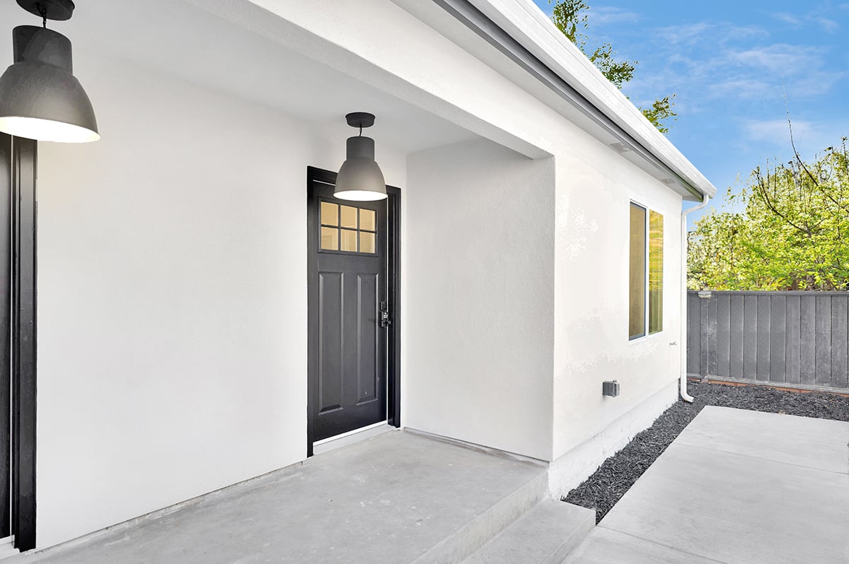 The double doors of the duplex units creates an inviting covered entry space.