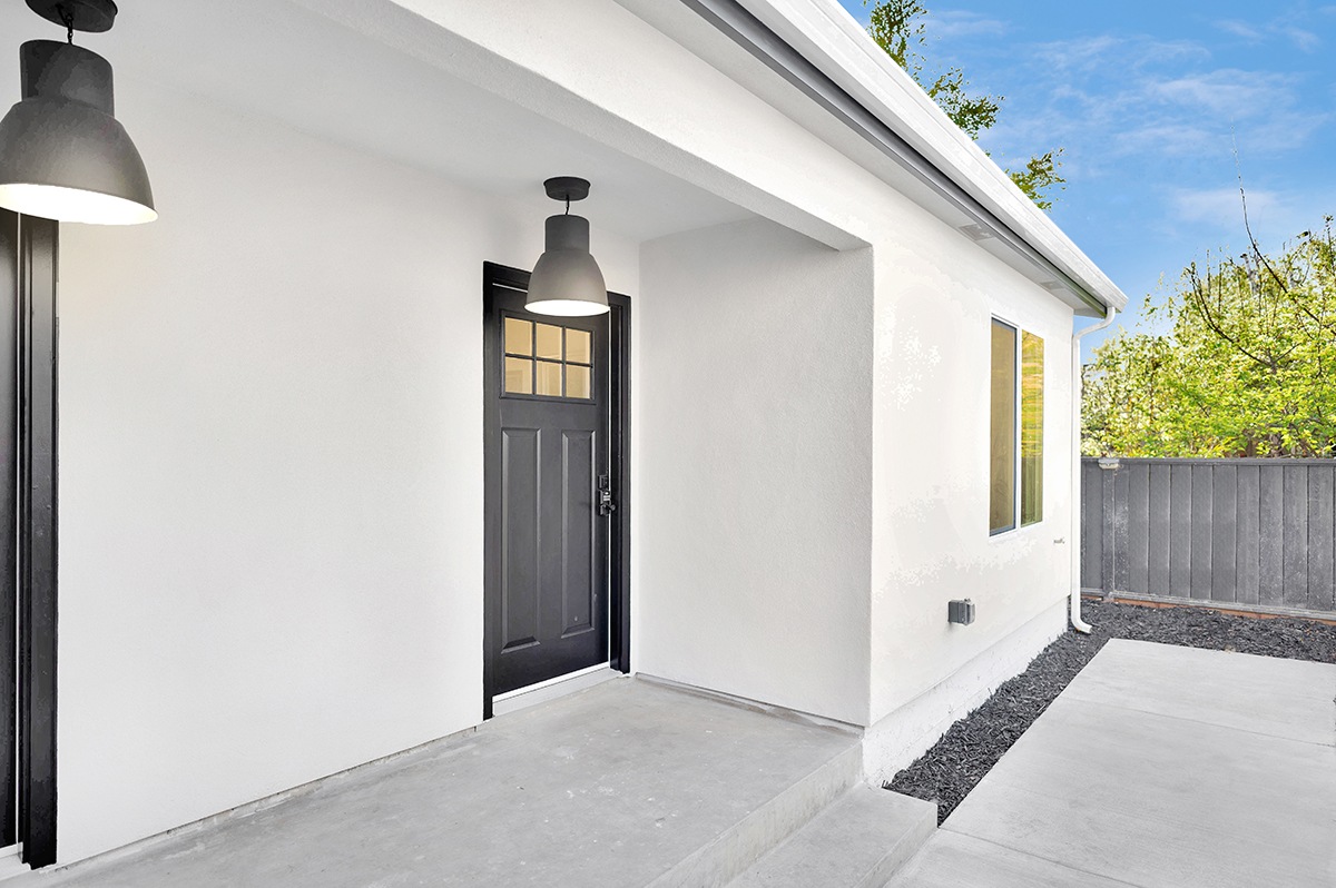 The double doors of the duplex units creates an inviting covered entry space.